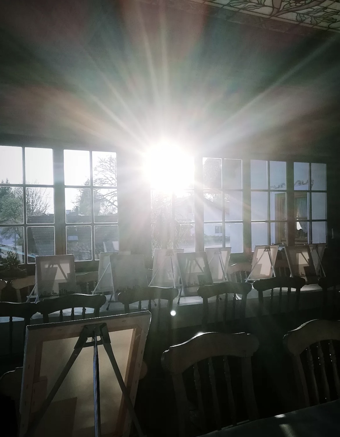 Sunlit art studio with easels